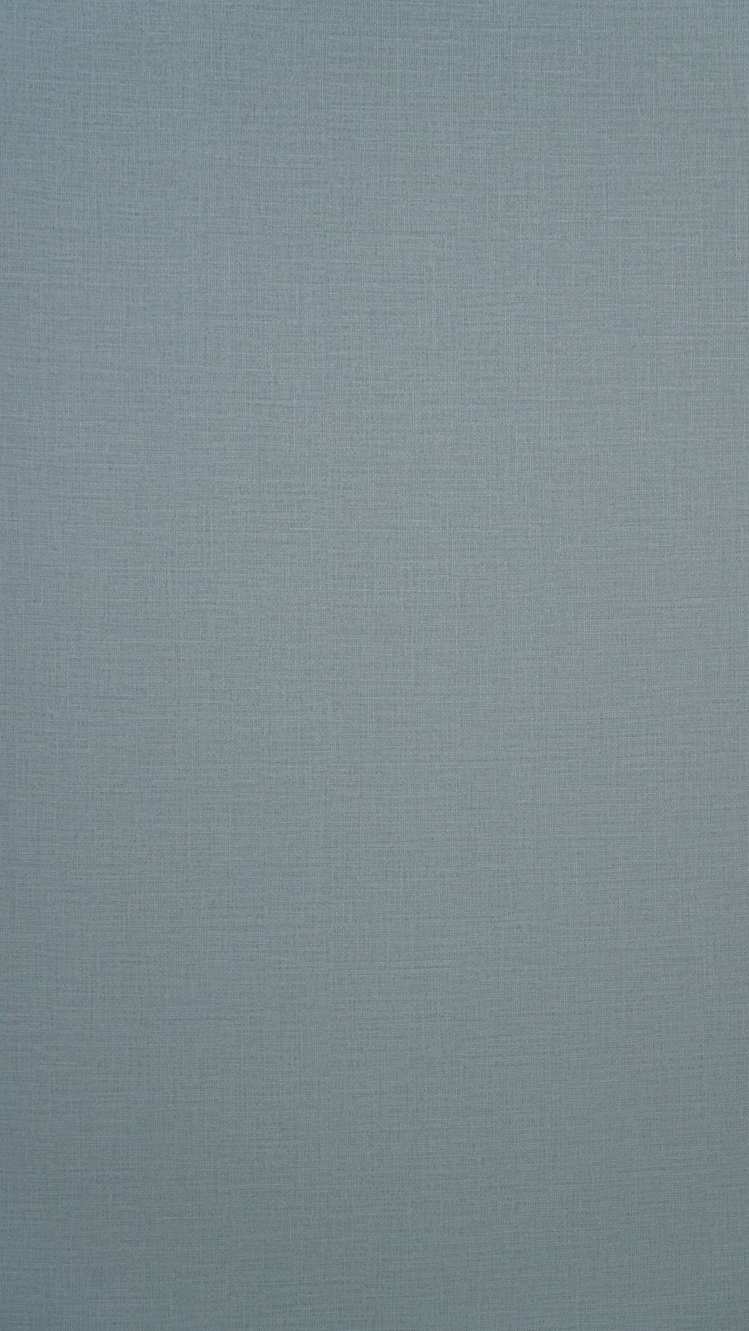 Dusty blue-grey linen-weave decor with visible warp and weft threads.