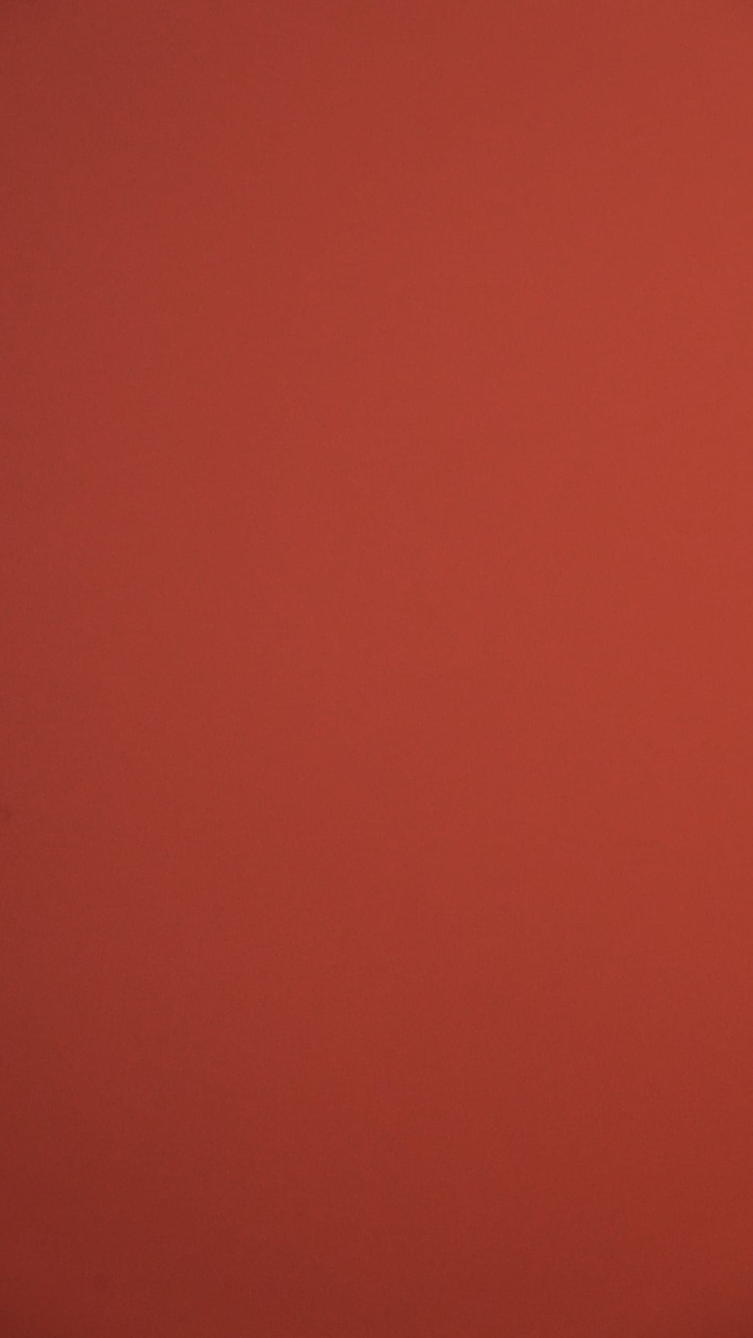 Flat, matte terracotta-red swatch with no texture or figure.
