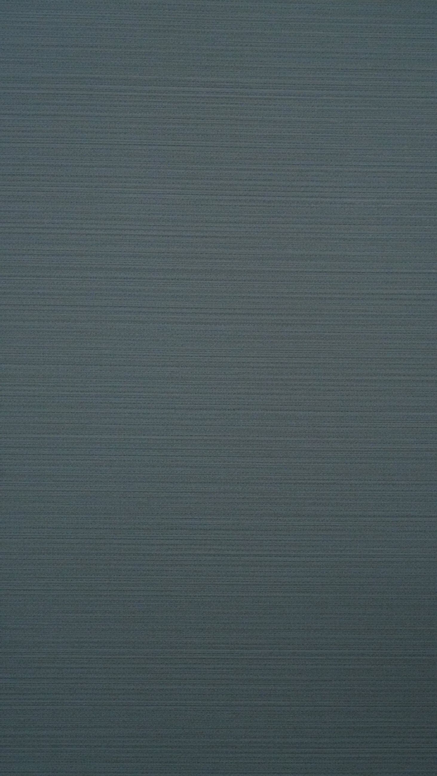 Slate blue-grey decor with fine horizontal striations and a soft satin sheen.