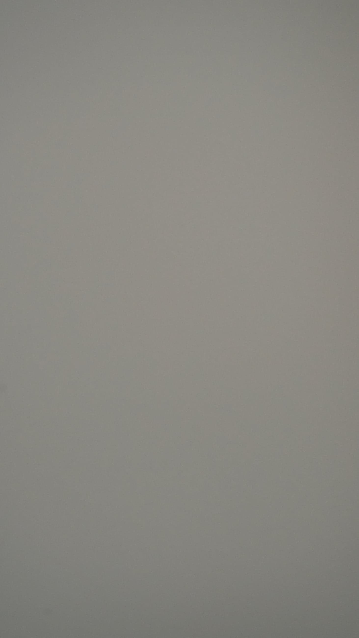 Flat, matte mid-grey swatch with a slight warm cast.